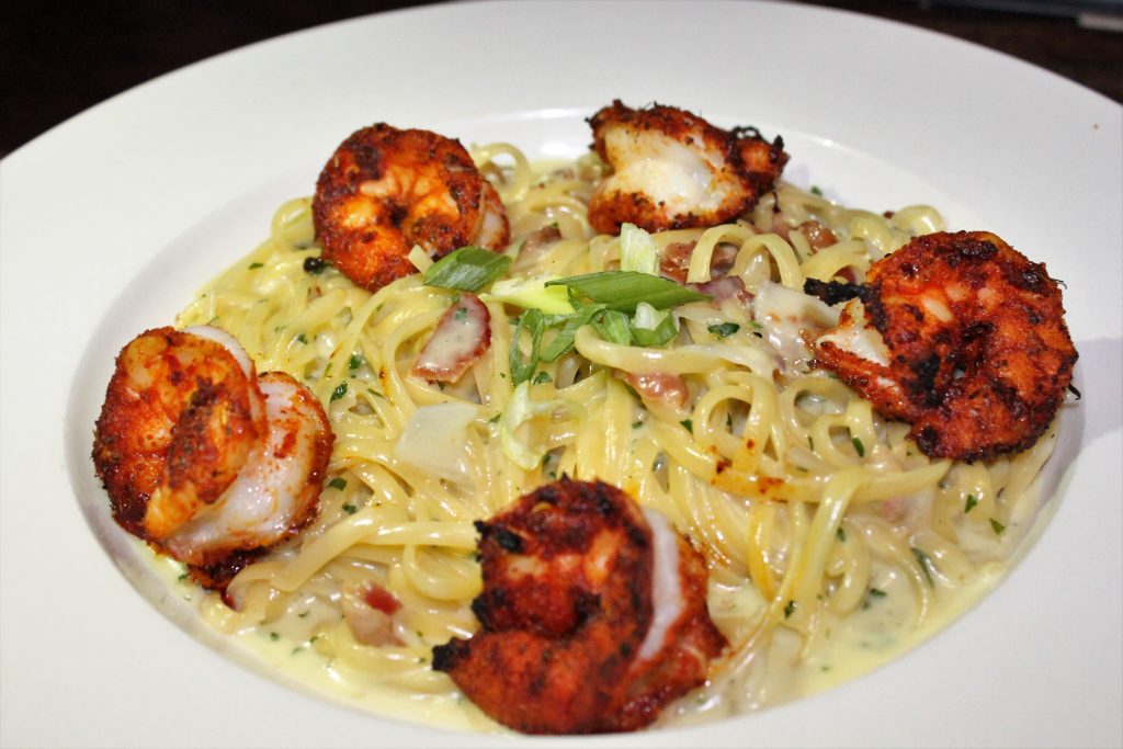 Black and Blue pasta — linguine in roasted garlic cream with blackened shrimp and scallions