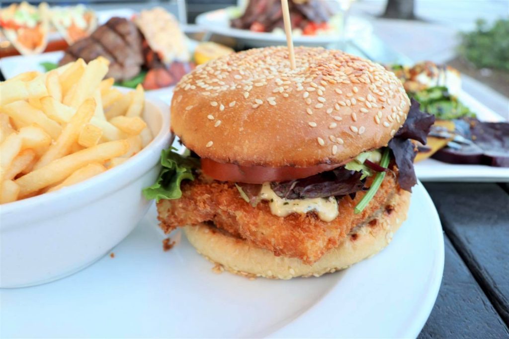 Crunchy Cod Sandwich Panko crusted, lettuce, tomato, onion, creole tartar, sesame bun.